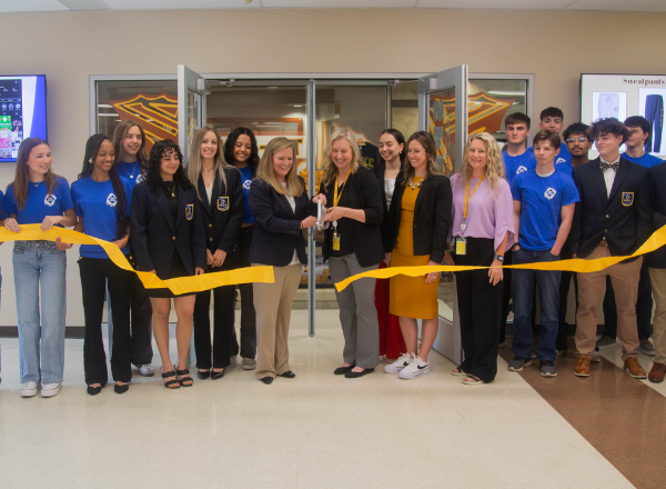  Students and staff cut the ribbon at Kickapoo's spirit store opening